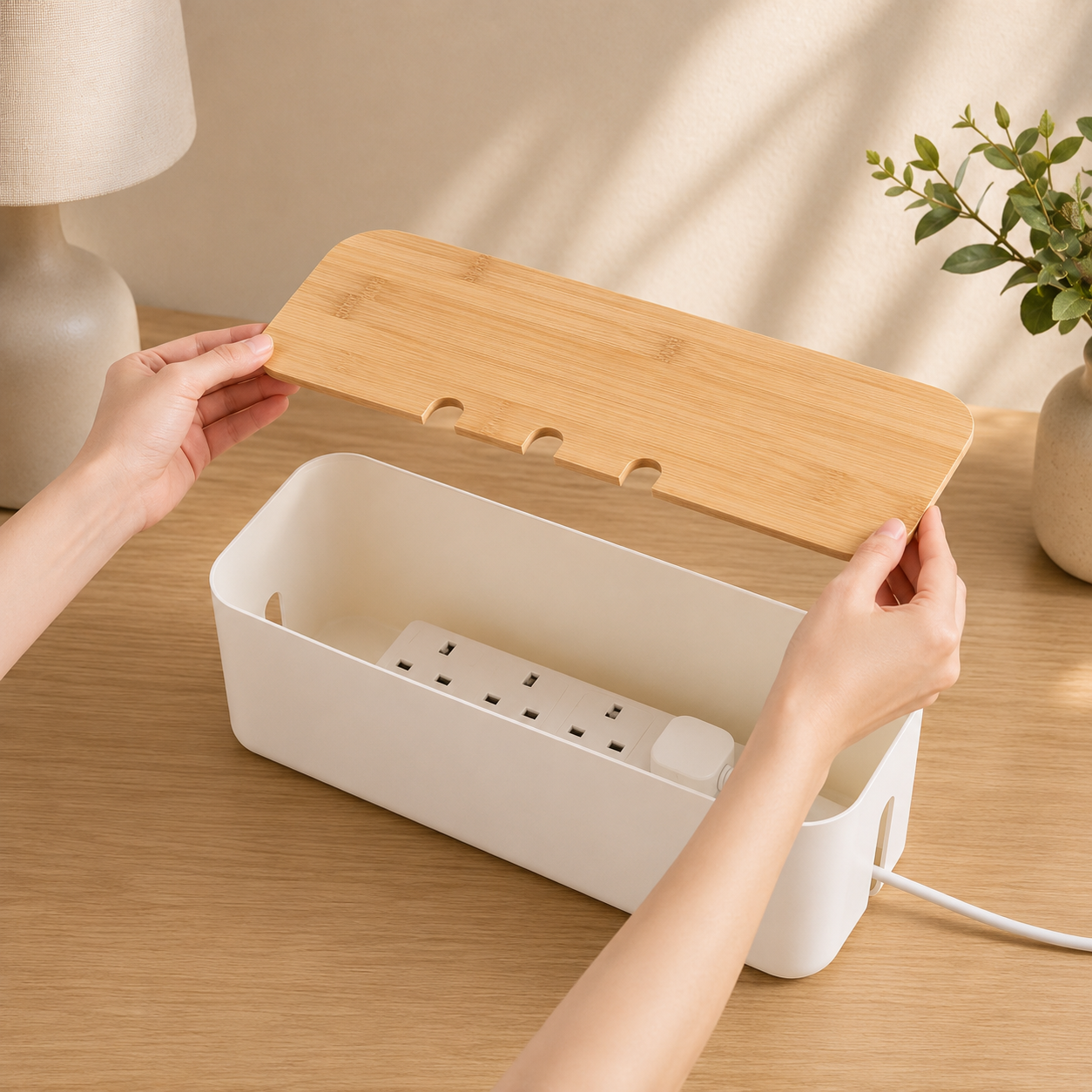 White bamboo cable box open with a power strip inside
